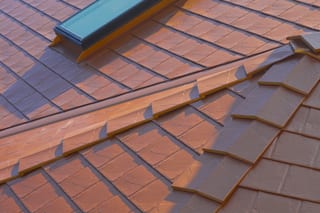 Copper Penny Interlock Slate aluminum roof on a copper penny metal roof on a craftsman style home in, Ladysmith, British Columbia
