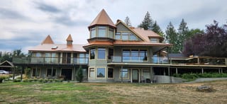 Copper Penny Interlock Slate aluminum roof on a large house with a copper penny metal roof in a coastal, Ladysmith, British Columbia