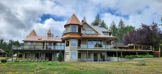 Copper Penny Interlock Slate aluminum roof being installed on the home, replacing a worn out wood shake roof, Ladysmith, British Columbia