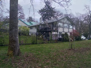 Black Interlock Slate aluminum roof on a house with a metal roof in a rural setting, Victoria, British Columbia