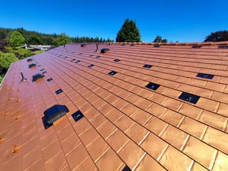Copper Penny Interlock Slate aluminum roof on a copper penny Interlock Slate metal roof on a two-storey, Victoria, British Columbia