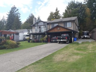 Before: a leaking asphalt shingle roof on the home, Chemainus, British Columbia, ahead of a Black Interlock Slate aluminum roof