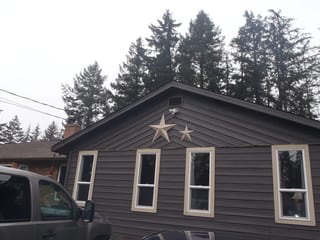 Before: a leaking asphalt shingle roof on the home, Comox, British Columbia, ahead of a Black Interlock Slate aluminum roof