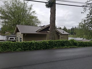 Colonial Brown Interlock Slate aluminum roof on a Colonial brown metal roof on a single-family home in a, Shawnigan Lake, British Columbia