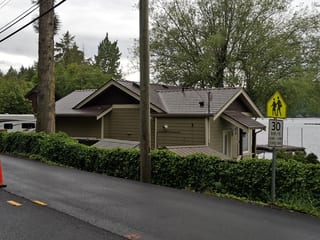 Colonial Brown Interlock Slate aluminum roof on a brown single-family home with Colonial style and a, Shawnigan Lake, British Columbia