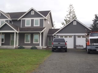 Before: a leaking asphalt shingle roof on the home, Sooke, British Columbia, ahead of a Black Interlock Slate aluminum roof