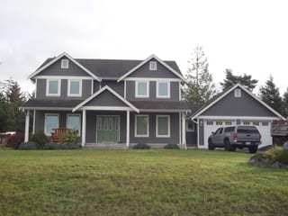 Before: a leaking asphalt shingle roof on the home, Sooke, British Columbia, ahead of a Black Interlock Slate aluminum roof