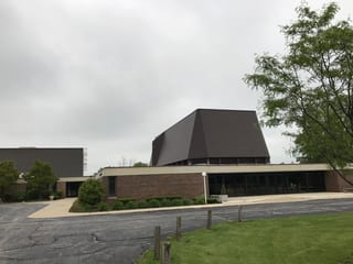 White Interlock IB Membrane aluminum roof on a brick commercial building with an aluminum roof in, Chicago Heights, Illinois