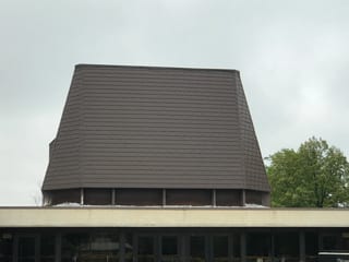White Interlock IB Membrane aluminum roof on a beige home with a metal roof in a rural setting, Chicago Heights, Illinois