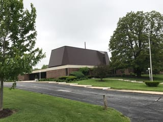 White Interlock IB Membrane aluminum roof on a white metal roof on a single-storey home in a suburban, Chicago Heights, Illinois