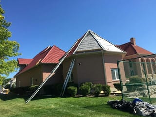 Tile Red Interlock Tile aluminum roof being installed on the home, replacing a concrete tile roof with broken tiles, South Barrington, Illinois