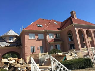 Tile Red Interlock Tile aluminum roof being installed on the home, replacing a concrete tile roof with broken tiles, South Barrington, Illinois
