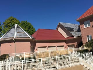 Tile Red Interlock Tile aluminum roof being installed on the home, replacing a concrete tile roof with broken tiles, South Barrington, Illinois