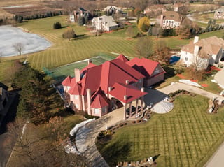 Tile Red Interlock Tile aluminum roof on a red roofed colonial home in a suburban setting, South Barrington, Illinois