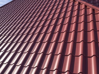 Tile Red Interlock Tile aluminum roof on a red roof on a house in a suburban neighbourhood, South Barrington, Illinois