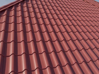 Tile Red Interlock Tile aluminum roof on a red roof on a single-family home in a suburban area, South Barrington, Illinois