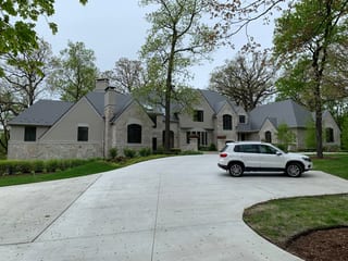 Musket Grey Interlock Slate aluminum roof on a colonial style home with a slate metal roof in a forested, Long Grove, Illinois