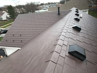 Colonial Brown Interlock Slate aluminum roof on a brown two-storey home with a Colonial style and dormers, Carol Stream, Illinois