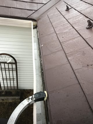 Colonial Brown Interlock Slate aluminum roof being installed on the home, replacing a worn out asphalt shingle roof, Carol Stream, Illinois
