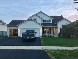 Before: a worn out asphalt shingle roof on the home, Carol Stream, Illinois, ahead of a Colonial Brown Interlock Slate aluminum roof
