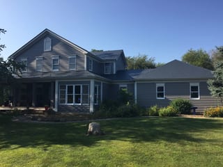 Deep Charcoal Interlock Slate aluminum roof on a colonial home with a deep charcoal metal roof in a rural, Plano, Illinois