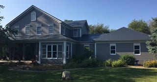 Deep Charcoal Interlock Slate aluminum roof on a deep charcoal two-storey Colonial home with dormers among, Plano, Illinois