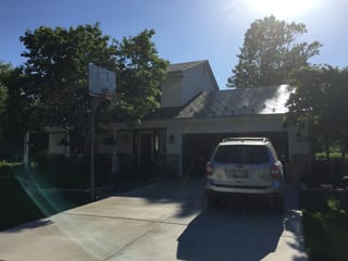 Black Interlock Slate aluminum roof on a two-storey home with a metal roof in a suburban, Batavia, Illinois