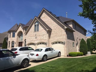 Tudor Brown Interlock Slate aluminum roof on a Tudor style home with a metal roof in a suburban setting, Roselle, Illinois