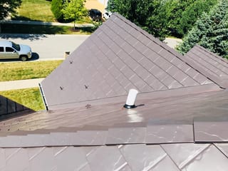 Tudor Brown Interlock Slate aluminum roof on a Tudor brown metal roof on a colonial home in a suburban, Roselle, Illinois