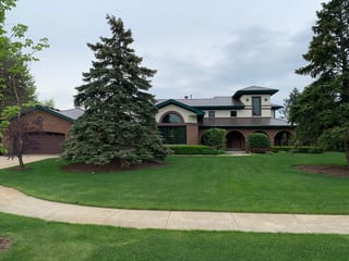 Colonial Brown Interlock Cedar Shingle aluminum roof on a colonial home with a brown metal roof in a suburban, Orland Park, Illinois