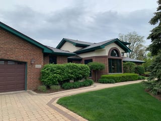 Colonial Brown Interlock Cedar Shingle aluminum roof on a colonial home with brown siding in a suburban setting, Orland Park, Illinois