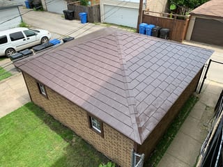 Colonial Brown Interlock Slate aluminum roof on a Colonial brown metal roof on a brown brick home in an, Chicago, Illinois