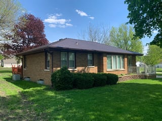 Colonial Brown Interlock Cedar Shingle aluminum roof being installed on a colonial home with a metal roof under construction in a, Wenona, Illinois