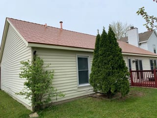 Copper Penny Interlock Cedar Shingle aluminum roof on a single-family home with a copper penny metal roof in a, Bolingbrook, Illinois