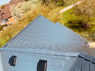 Deep Charcoal Interlock Slate aluminum roof on a home with a deep charcoal Interlock Slate metal roof in, Crystal Lake, Illinois