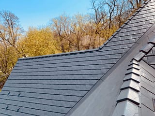 Deep Charcoal Interlock Slate aluminum roof on a Deep Charcoal metal roof on a single-storey home among, Crystal Lake, Illinois