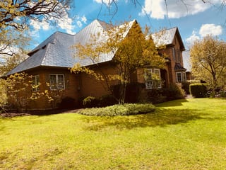 Deep Charcoal Interlock Slate aluminum roof on a two-storey Colonial home with dormers in a lakeside, Crystal Lake, Illinois