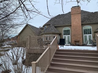 Before: a worn out wood shake roof on the home, Crystal Lake, Illinois, ahead of a Deep Charcoal Interlock Slate aluminum roof