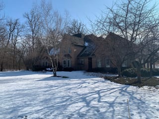 Before: a worn out wood shake roof on the home, Crystal Lake, Illinois, ahead of a Deep Charcoal Interlock Slate aluminum roof
