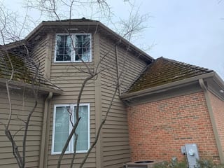 Before: a worn out wood shake roof on the home, Crystal Lake, Illinois, ahead of a Deep Charcoal Interlock Slate aluminum roof