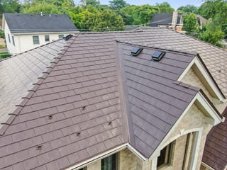 Colonial Brown Interlock Slate aluminum roof on a colonial home with a brown metal roof in the Calredon, Calredon Hills, Illinois