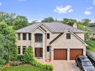 Colonial Brown Interlock Slate aluminum roof on a colonial home with two stories and a garage in a wooded, Calredon Hills, Illinois