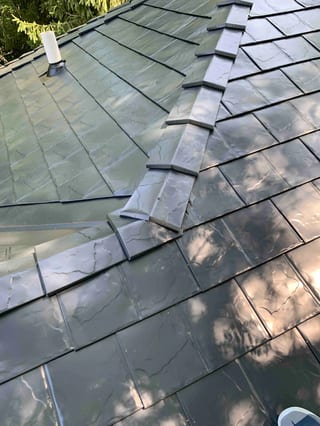 Black Interlock Slate aluminum roof on a black metal roof on a modern home in a suburban forest, Lombard, Illinois