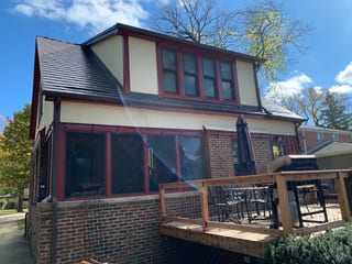 Tudor Brown Interlock Slate aluminum roof on a Tudor style home with a brown metal roof in a suburban, Elmhurst, Illinois