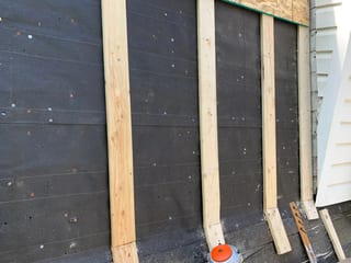 Black Interlock Slate aluminum roof being installed on the home, replacing a worn out asphalt shingle roof, Oak Park, Illinois