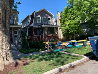 Black Interlock Slate aluminum roof being installed on the home, replacing a worn out asphalt shingle roof, Oak Park, Illinois