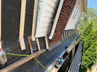 Black Interlock Slate aluminum roof being installed on the home, replacing a worn out asphalt shingle roof, Oak Park, Illinois
