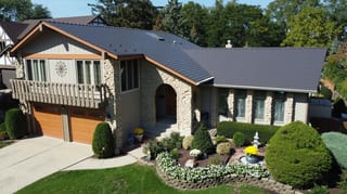 Tudor Brown Interlock Cedar Shingle aluminum roof on a Tudor brown metal roof on a two-storey colonial home, Bartlett, Illinois