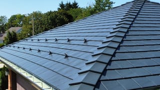 Deep Charcoal Interlock Slate aluminum roof on a Deep Charcoal Interlock Slate roof on a brown, Westmont, Illinois
