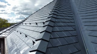 Black Interlock Slate aluminum roof on a black house with an Interlock Slate aluminum roof in a, Lemont, Illinois